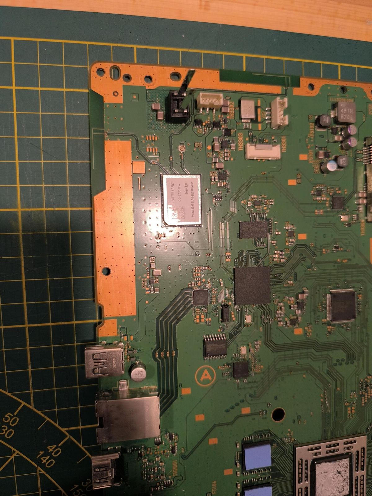 Scheda madre PS4 con la zona della porta HDMI